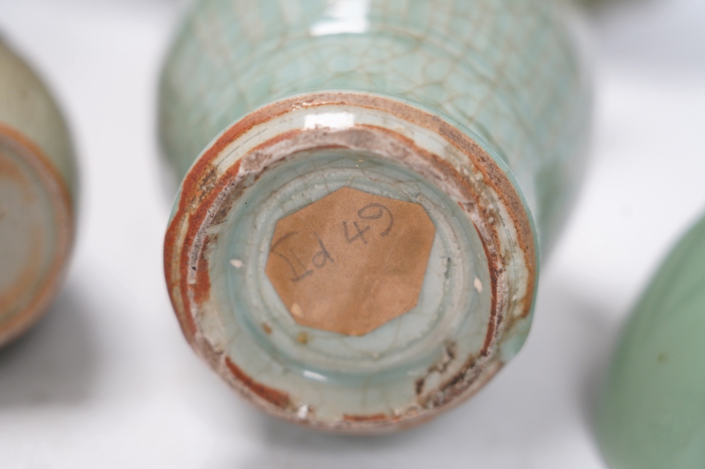 Four items of Chinese celadon porcelain and a similar pair of vases, tallest 19.5cm high. Condition - bottle vase and small pottery vase chipped, the others good
